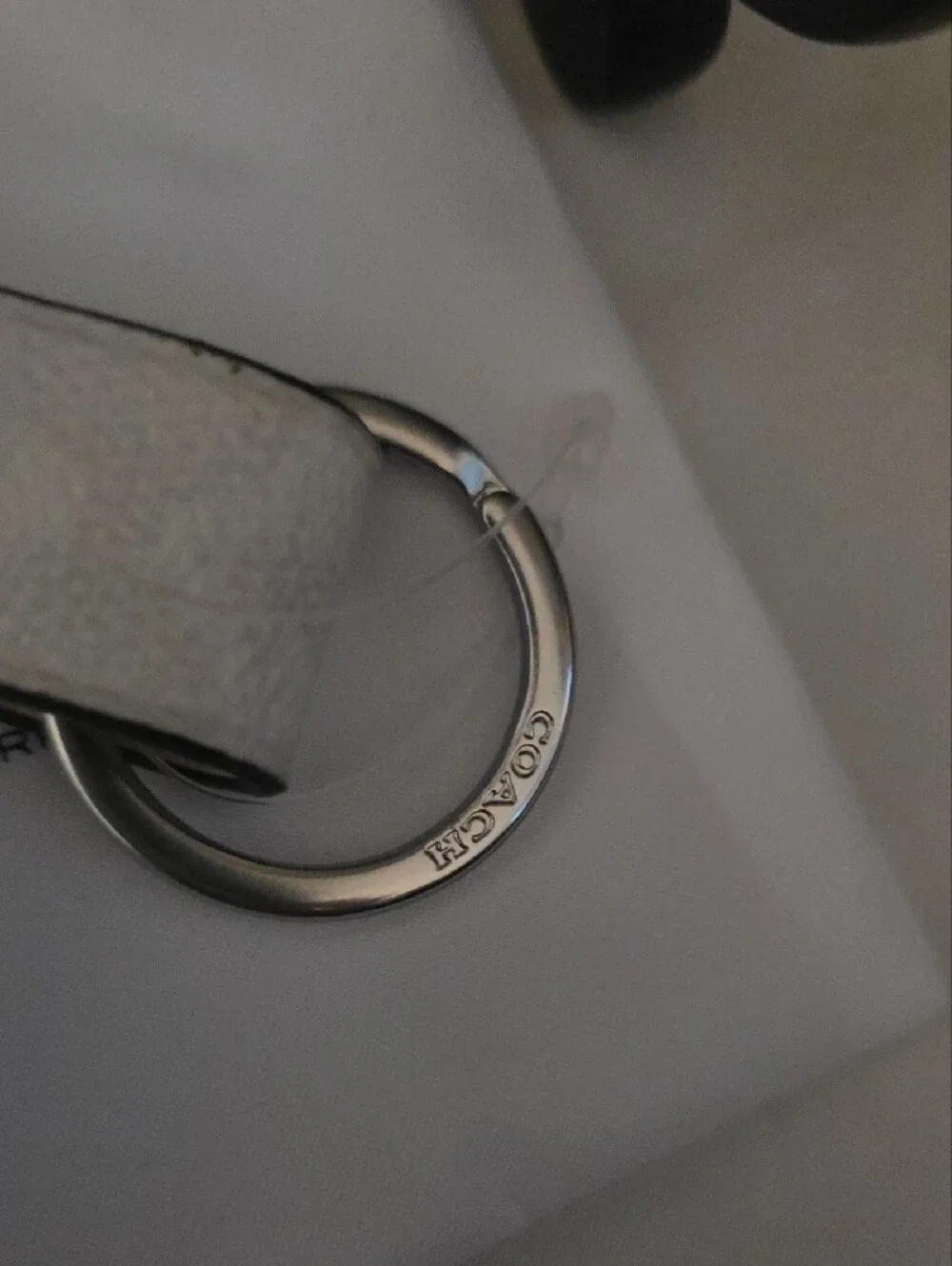Coach Silver Leather Turn-Lock Keychain